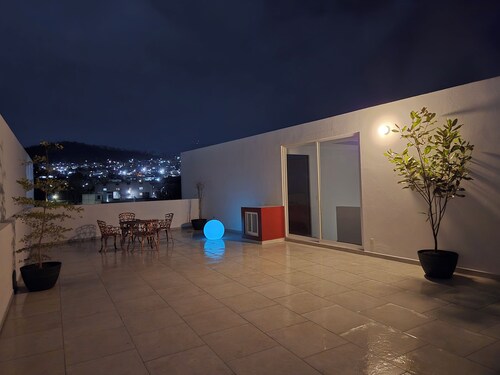 5-bedroom, 5-bathroom home with a rooftop garden offering panoramic views and a 2-car garage