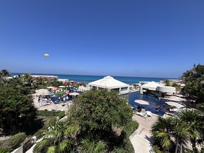 A resort with a swimming pool, water park, and beach view. - Caribbean Getaway with Beach Access and Pool, stunning view from your bedroom (Cancún)