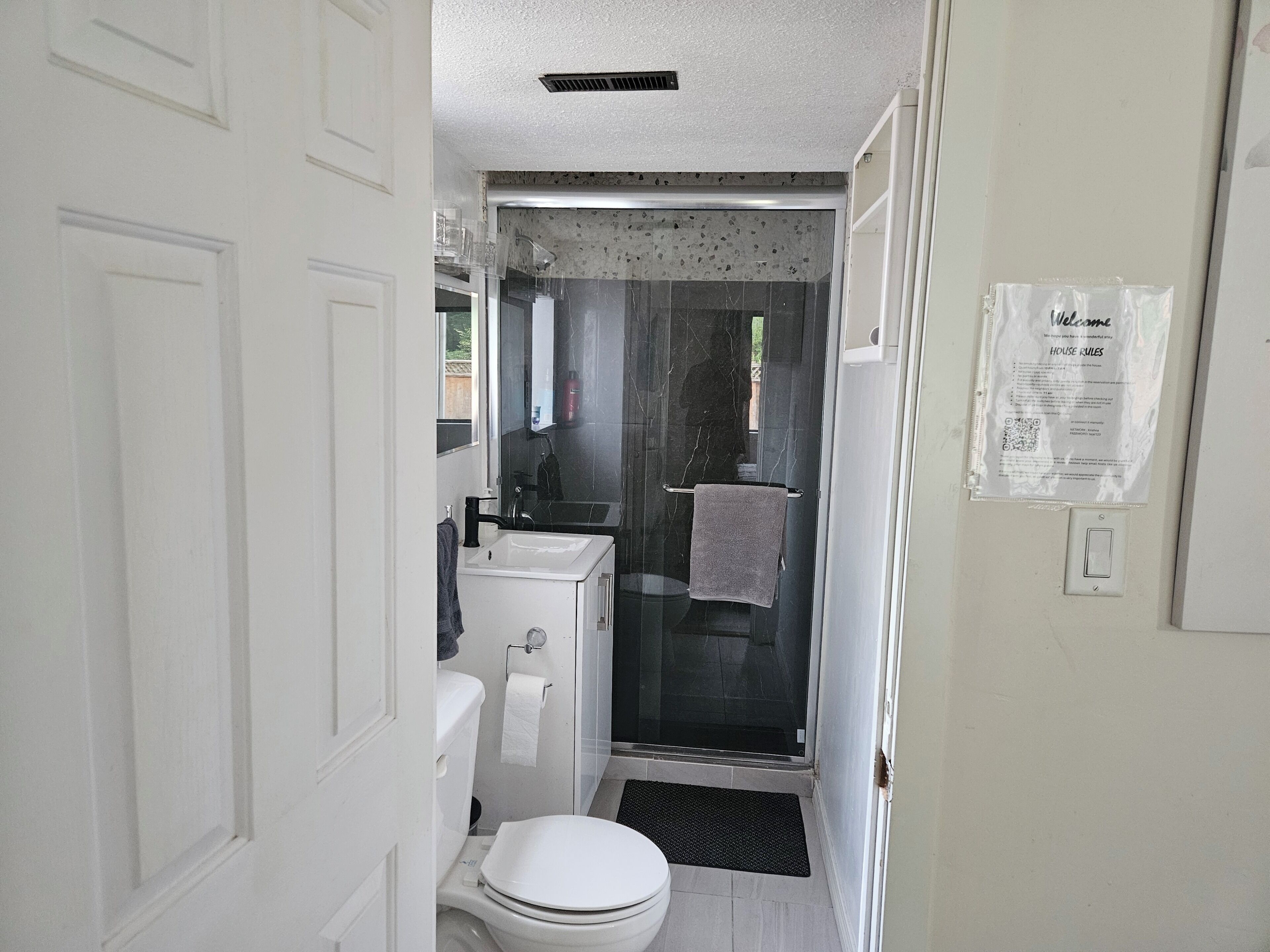 Shower, hair dryer, towels, toilet paper