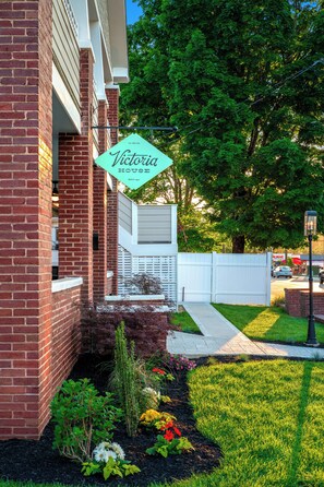 A brick building with a sign reading 'Victoria House.' - 1BR Hot Tub Suite • Tennessee (Sevierville)