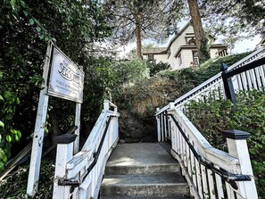 A staircase leading to a building with a sign indicating it's a public house for reservations.