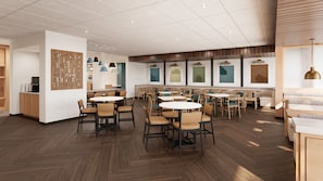 Un espace repas moderne avec des tables et des chaises rondes, un plancher en bois et des luminaires suspendus.