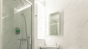 A modern bathroom with a glass-enclosed shower, a green vanity, and a white toilet. - Cloonacauneen Castle (Galway)
