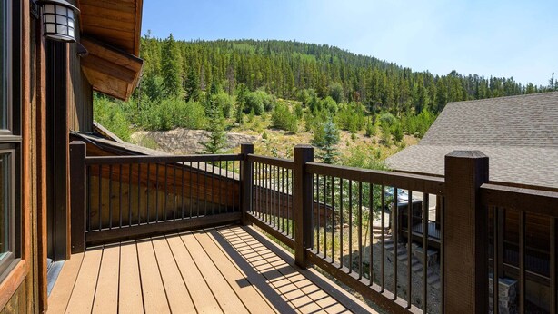 A wooden deck with a railing overlooking a forested hillside. - Winter Park Resort Villa 509 I Hot Tub I Great View I Theatre I Fire Table I Discounted Attractions (Winter Park)