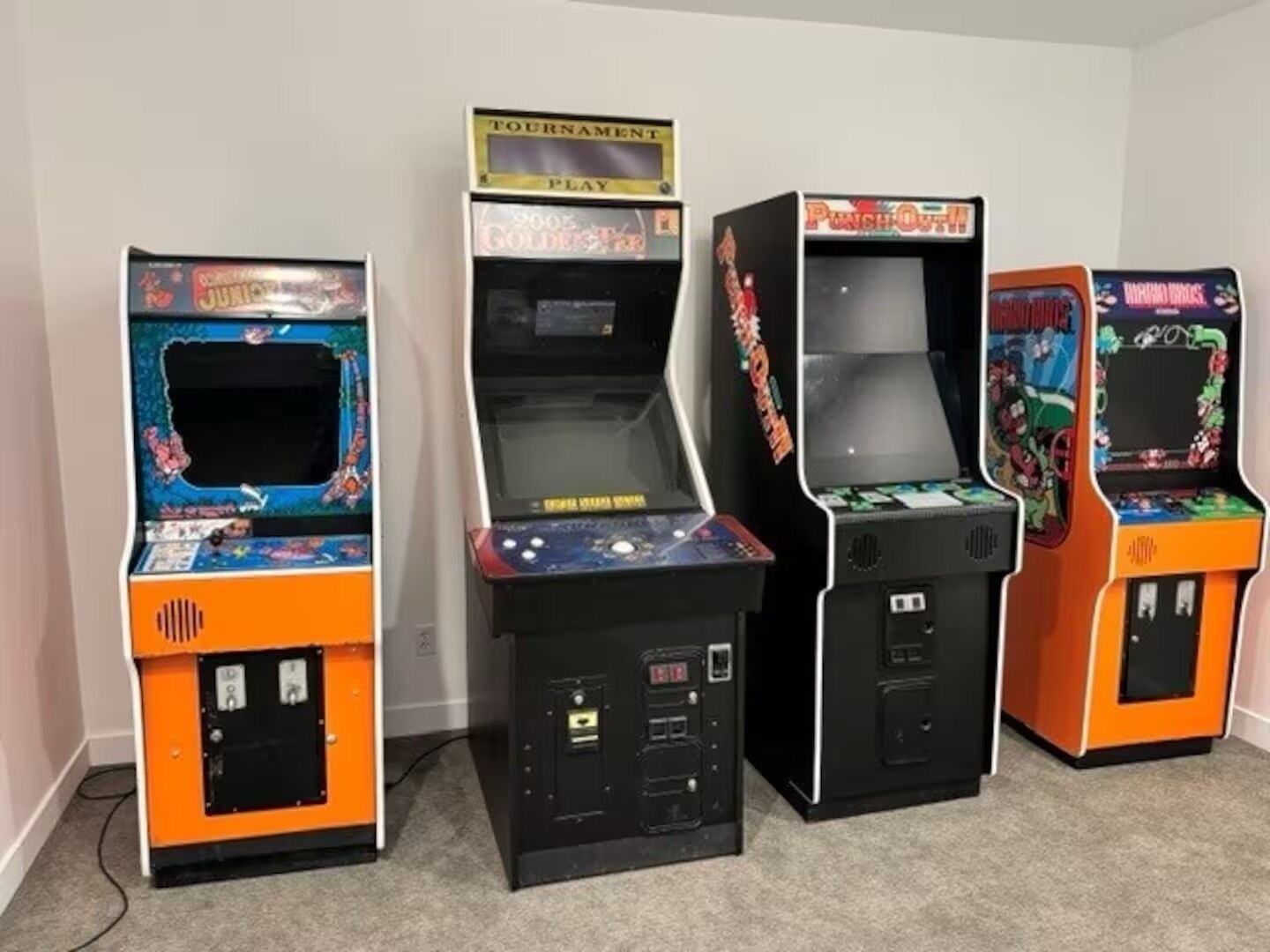Four arcade machines in a row.