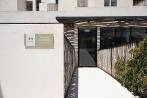 A gym entrance sign with a logo and text indicating the location. - RBK Departamento 2026 AC (Tulum)