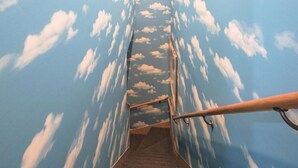 A staircase with a sky-like ceiling design, metal handrails, and carpeted steps. - #102 Shiba | Double Bed, Sleeps 2 | Quiet 1st Floor, Near Tokyo Tower (Minato City)
