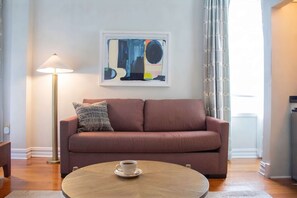 Living area - Spacious King Room | StayCozy at The Arco (Philadelphia)