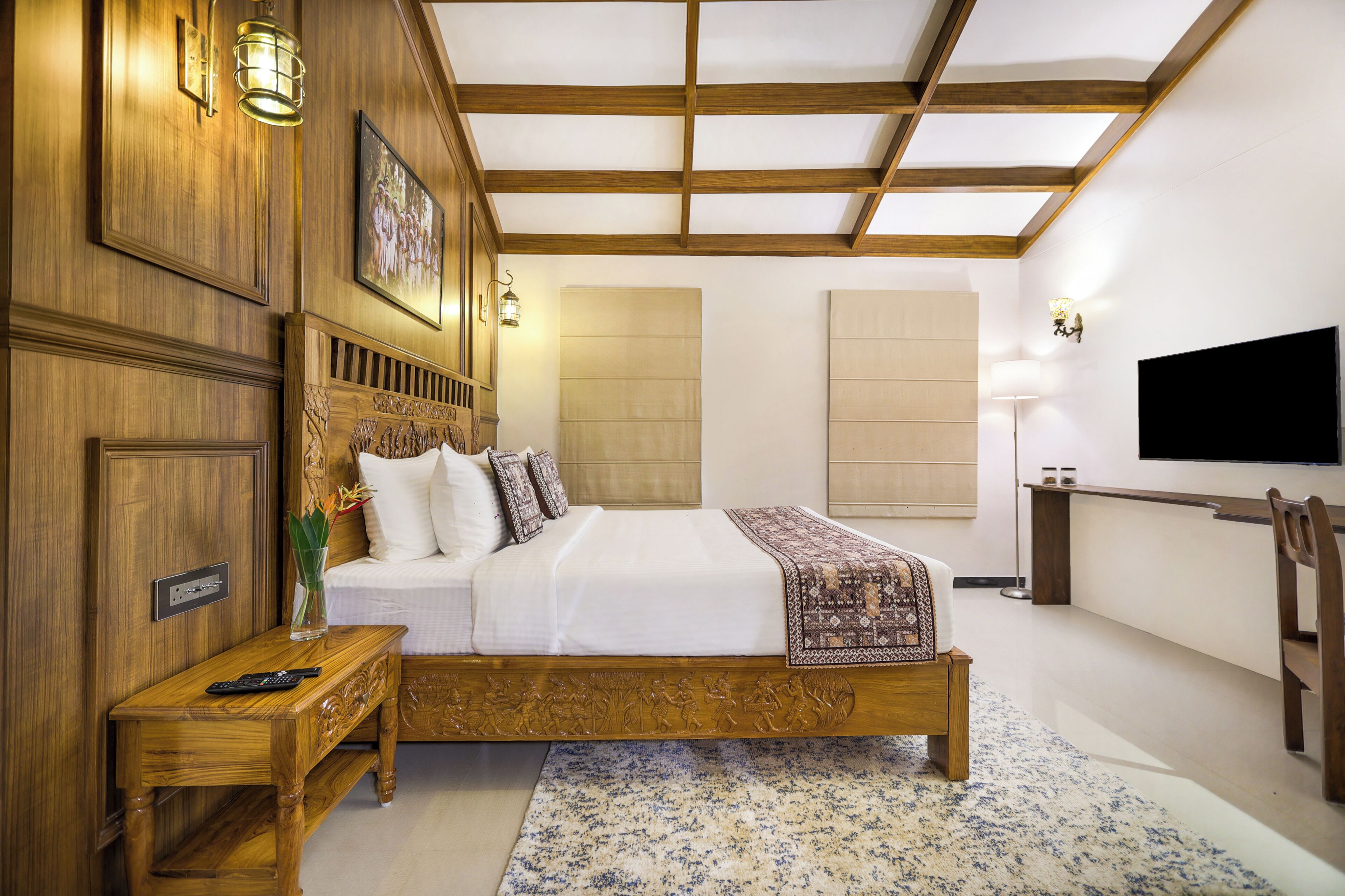 A bedroom with a wooden bed, bedside tables, a TV, and a large window.