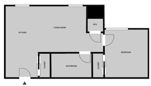 Ein Grundriss mit Küche, Wohnzimmer, Bad und Schlafzimmer.
