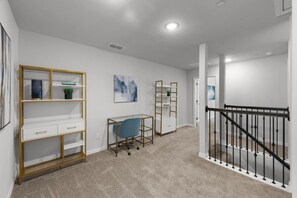 A room with a desk, shelving, and a staircase. - Lewisville Lake Urban Escape (Lewisville)