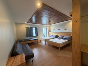 A room with a loft bed, a sofa, and a desk. - Inntayon Lodge Baguio City (Baguio)