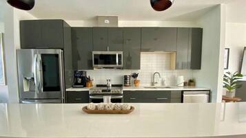 Coffee/tea maker, fridge, microwave, oven