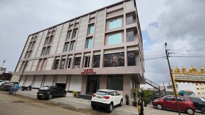 A multi-story building with a reception area labeled 'ARYA RECEPTION' on the ground floor. - Hotel Arya Executive (Sawardari)