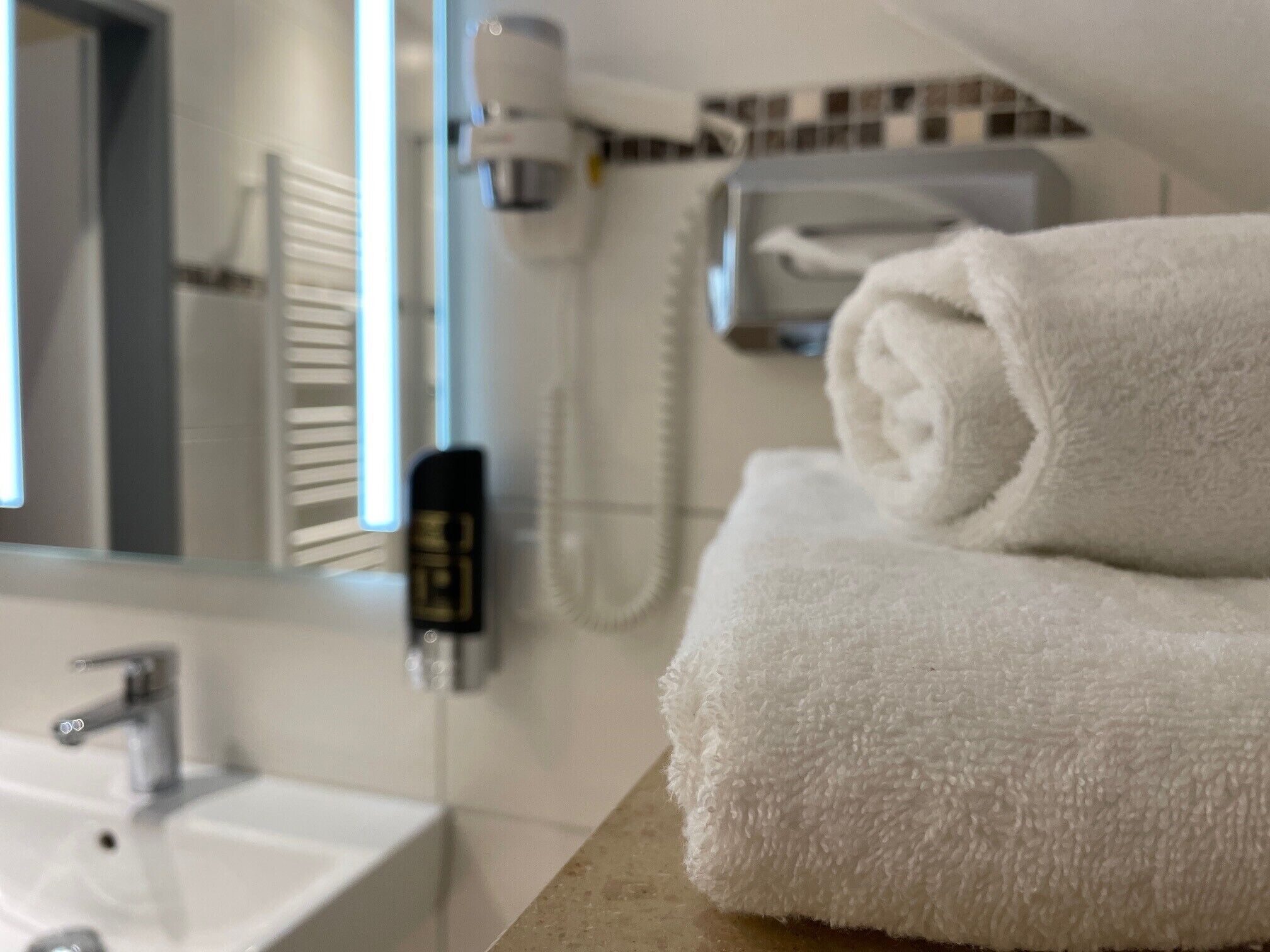 Shower, hair dryer, towels, shampoo