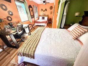 A bedroom with a bed, desk, chair, and a ceiling fan. - Tropical Getaway! Jungle Stay! Central Spot for Volcanos & Black Sand Beaches! (Pāhoa)