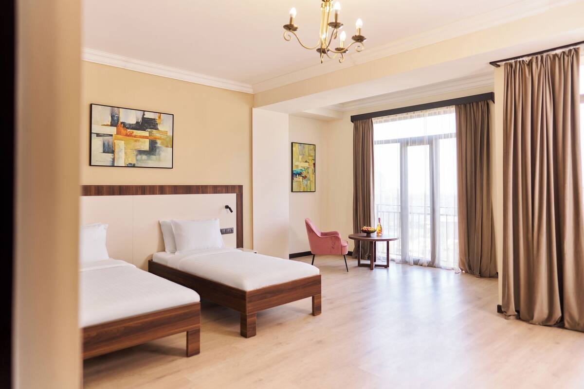 Junior Twin Room, Balcony, City View | In-room safe, free WiFi