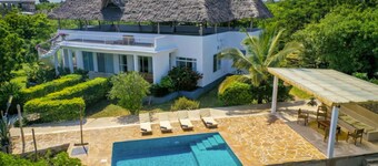 Breezy Coastal Luxury: Modern Villa Living in Fumba Town, Zanzibar