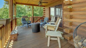 A wooden deck with outdoor furniture, a ceiling fan, and a fire pit. - Mountain Top Lodge with Amazing Vista (Jasper)