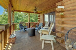 A wooden deck with outdoor furniture, a ceiling fan, and a fire pit. - Mountain Top Lodge with Amazing Vista (Jasper)