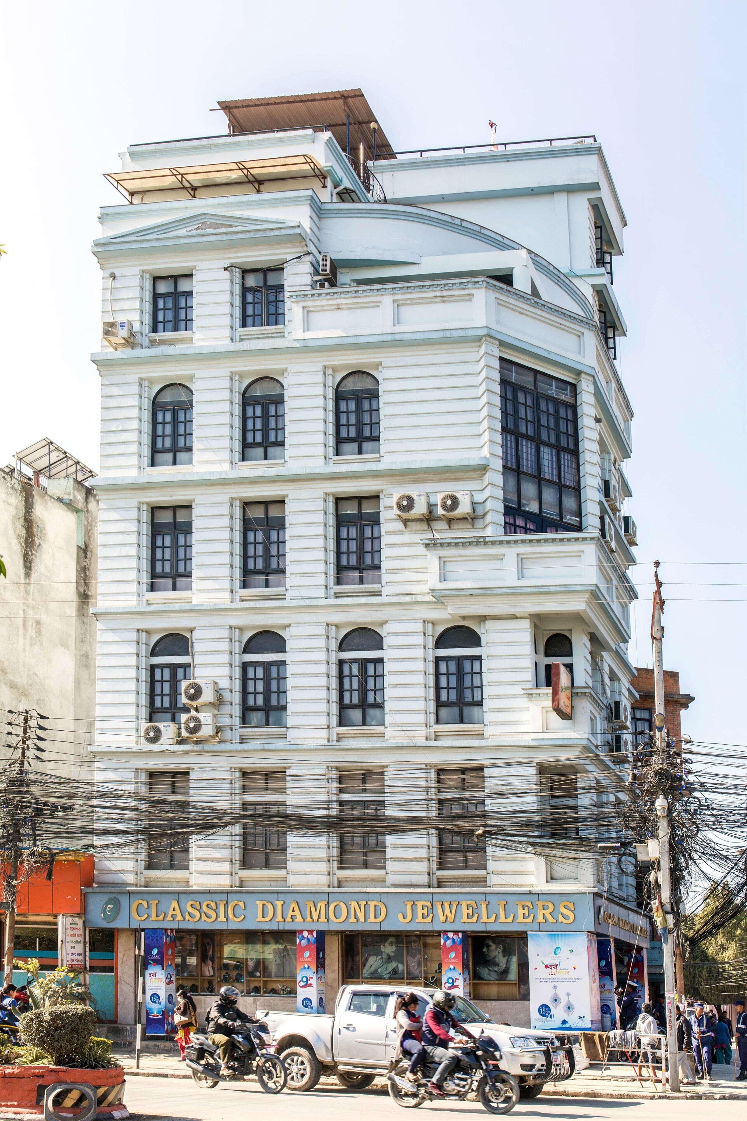 A multi-story building with a storefront labeled 'Classic Diamond Jewellers'.