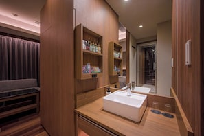 A modern bathroom with a large mirror, a white sink, and wooden cabinetry. - HOTEL TWIN FLAG (Ichikawa)