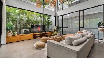 Villa, 5 Bedrooms, Pool View | Living area | 65-inch Smart TV with cable channels, Netflix, streaming services