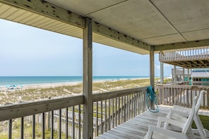 A wooden deck with a view of the beach and ocean. - Big Fish - Classic 4BR Oceanfront Home - Covered Porch (Topsail Beach)