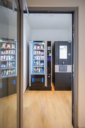 A vending machine area with various snack and drink options.