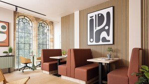 A modern interior with seating, a table, and a large abstract painting. - Student Only Cathedral Park (Bristol)