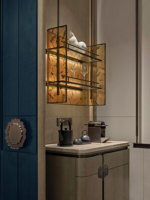 A modern bathroom with a wooden vanity, a glass shelf with a decorative item, and a kettle. - Financial City Hotel Chengdu-Mgallery Collection (Chengdu)