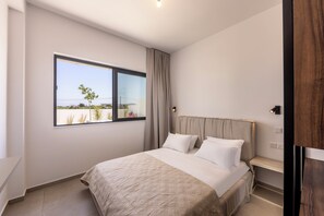 A bedroom with a bed, a window, and a view of the outdoors. - New 4 Bedroom Villa With Panoramic sea Views (Paralimni)