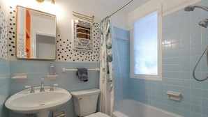 A bathroom with a sink, toilet, and bathtub. - Mid-term Stay in Austin! Family Home w/ Backyard (Austin)