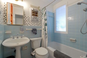 A bathroom with a sink, toilet, and bathtub. - Mid-term Stay in Austin! Family Home w/ Backyard (Austin)