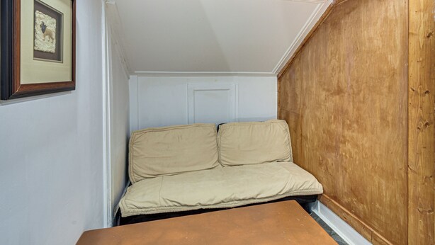 A small room with a wooden ceiling, a white door, and a beige sofa. - Hike, Fish & Explore! Family Getaway in Elberton (Elberton)