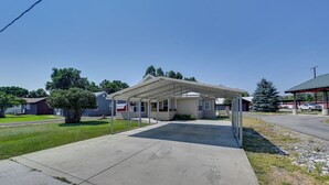 A single-story house with a covered porch and a concrete driveway.