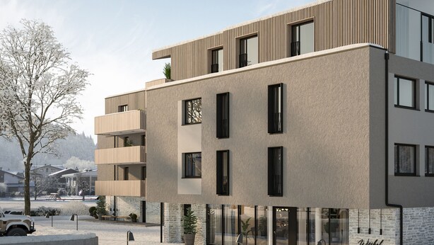 Un edificio a più piani con un design architettonico moderno, caratterizzato da balconi e ampie finestre.