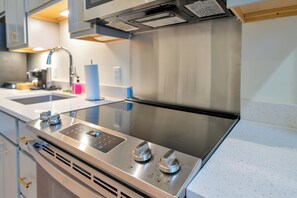 A modern kitchen with a stainless steel range hood, a digital control panel, and a double sink. - City View Studio - Nearby Parking - Downtown - 3F (Louisville)