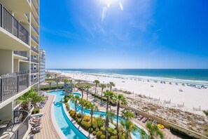 A resort with a swimming pool, beach, and ocean view. - Phoenix West 405 3 Bedroom Condo (Orange Beach)