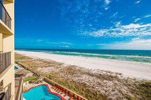 A beachfront hotel with a swimming pool, beach access, and ocean views. - Phoenix Iii 3055 1 Bedroom Condo (Orange Beach)