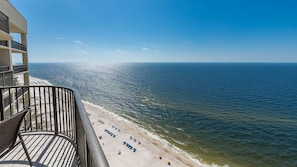 A balcony with a view of a beach and ocean. - Phoenix West 2606 3 Bedroom Condo (Orange Beach)
