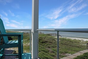A balcony with a view of the beach and the ocean. - 🌊Singing Waves | Stunning Beachfront | Community Pool | Pet Friendly (Cape San Blas)