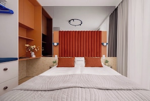 A modern bedroom with a bed, a nightstand, a wall-mounted clock, and a window with curtains. - Luxury Apartment in Chmielna Duo |Air Conditioning (Warszawa)