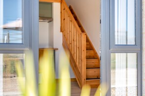 A staircase with wooden railings leading to an upper floor.