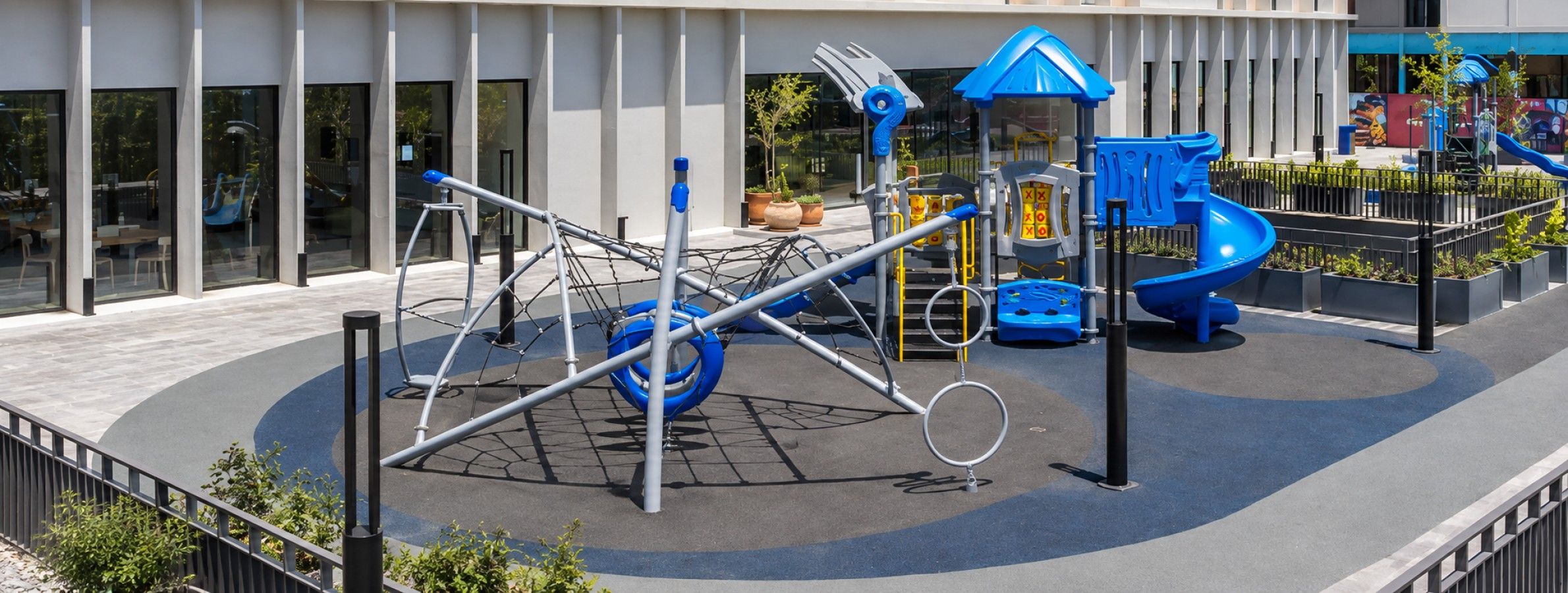 A playground with swings, slides, and climbing structures.
