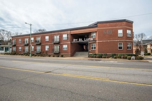 A two-story brick building with a sign reading '2nd St. Lofts' and a parking lot in front. - The Lofts of Downtown (540 N 2nd St, #210) (Clarksville)