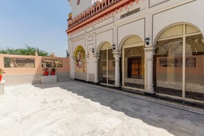 A building with arched windows and a mural.