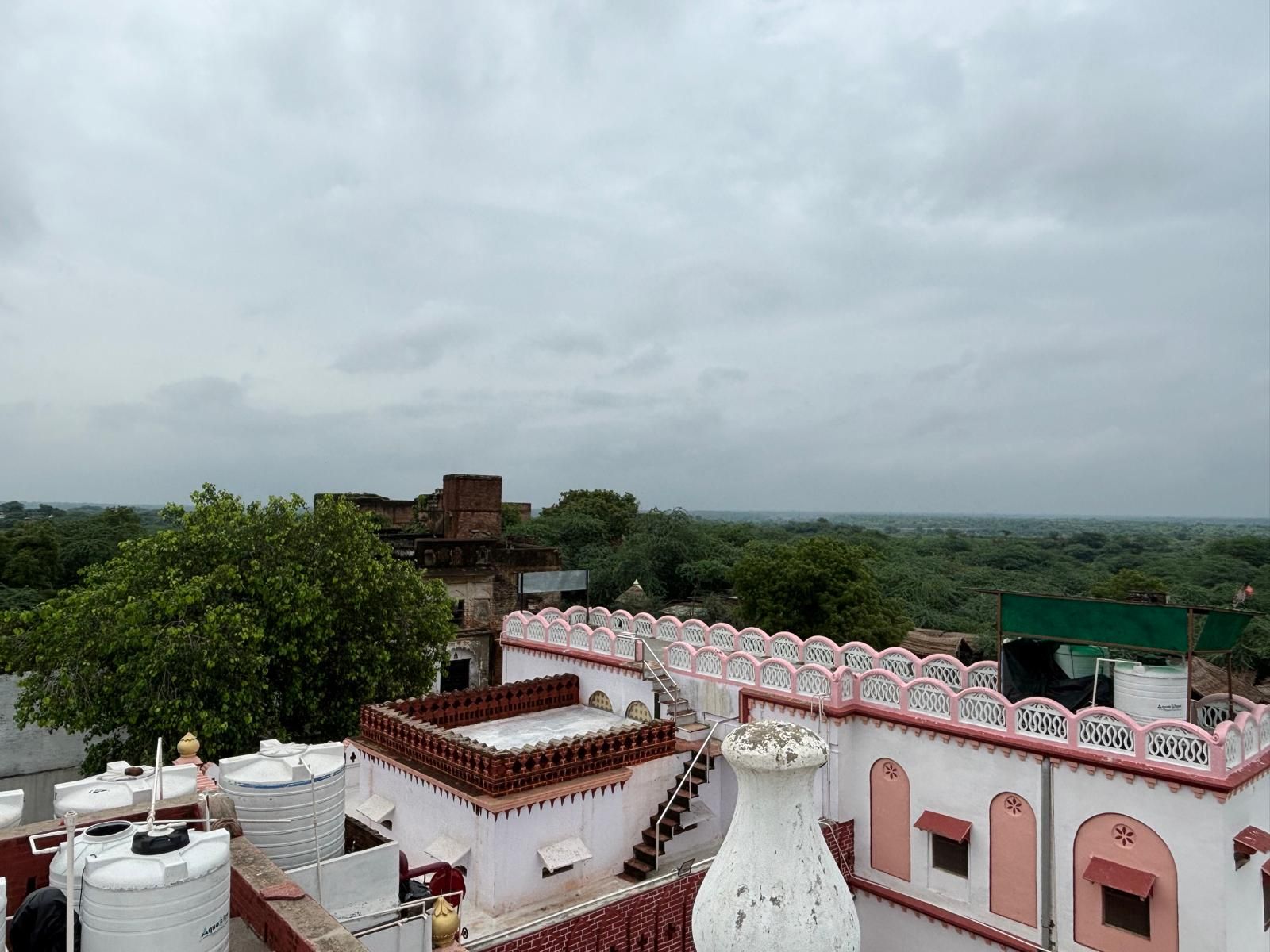 A building with a traditional architectural style, featuring a prominent white dome and a red-tiled roof.