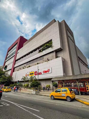 A multi-story building with a prominent 'Café' sign on the ground floor. - Entire Building for Groups of 16+ in Medellín (Medellín)