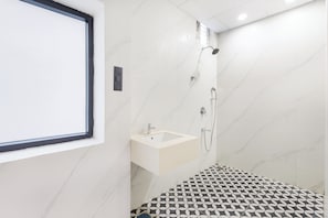 Family Studio | Bathroom | Shower, hair dryer, slippers, towels - Monday Hotels & Suites Madhapur (Hyderabad)